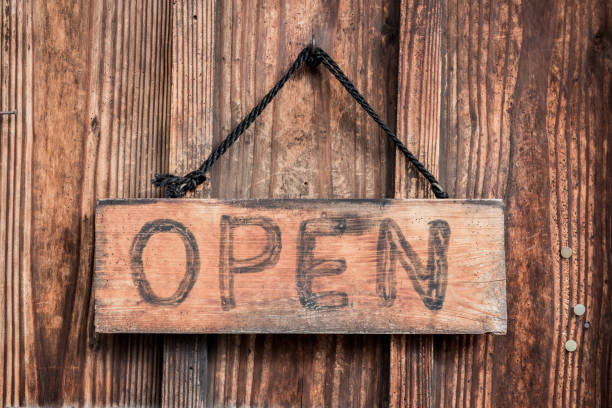 istock open sign on wood background and texture 653054570