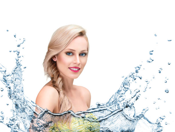 istock Beautiful woman face with water splash 653061892