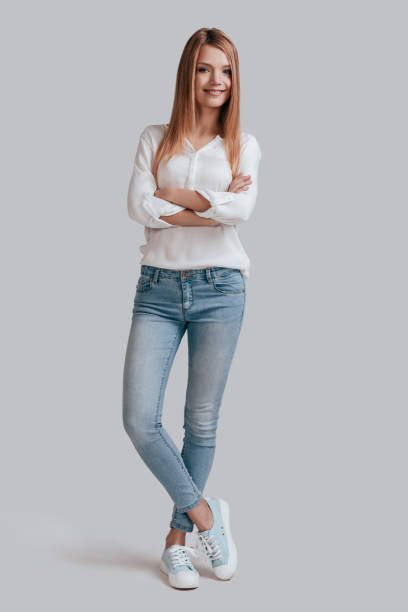 istock Confident woman. rey background 653062426