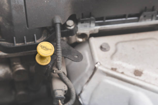 istock Close-up of a yellow engine oil dipstick with selective focus 653065746