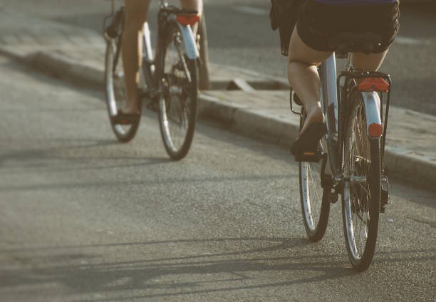 istock Women riding on bicycles around the city. 653065986