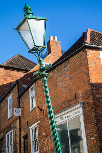 Lincoln, UK - February 28, 2017: The famous leaning lamp post situated on the historic Steep Hill in the city of Lincoln, UK on 28th February 2017.
