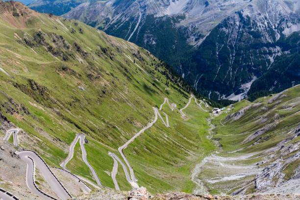 istock Serpentine mountain road surrounded by green hills. 653072464