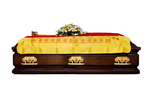 A brown Casket at a traditional Chinese funeral services in isolated white background.