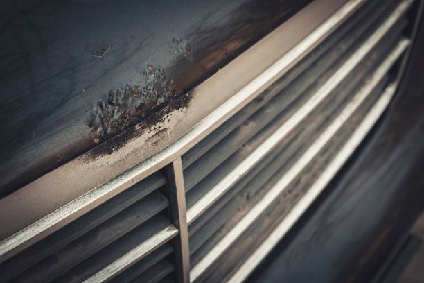 istock Dark car hood with rust and corrosion. 653075916
