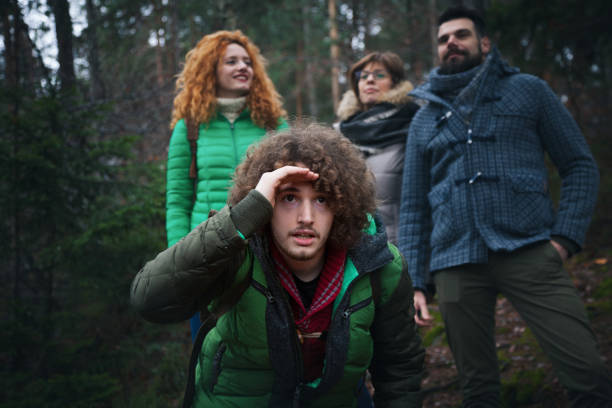 istock Group of friends into wood 653077340