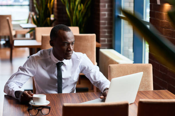 istock Busy African man in cafe 653084568