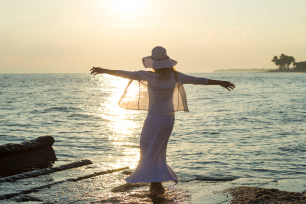 istock Young women enjoying vacation at the beach 653089620