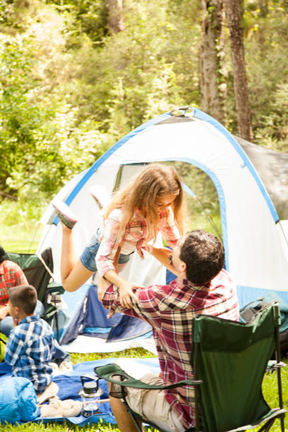 istock Family enjoys summer camping vacation. 653100894