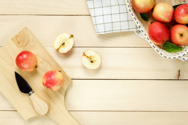 istock Top view red apple napkin,knift,basket on wooden. 653101330