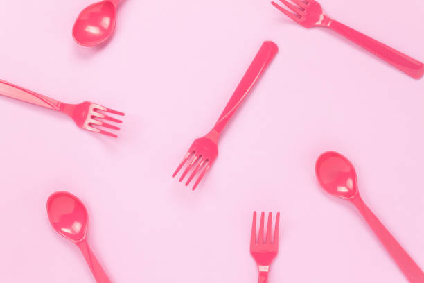 istock Top view colorful plastic spoon on pink table background with copy space. 653101586