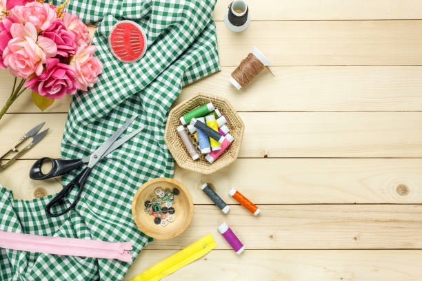 istock Top view tailor items on wooden background with copy space. 653101732