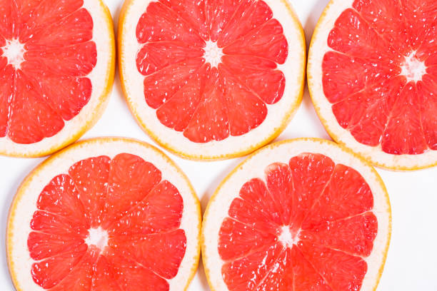 istock Texture of a ripe grapefruit slice, closeup 653101800