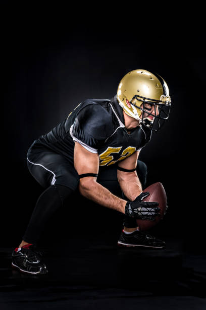 istock American football player in uniform 653102142