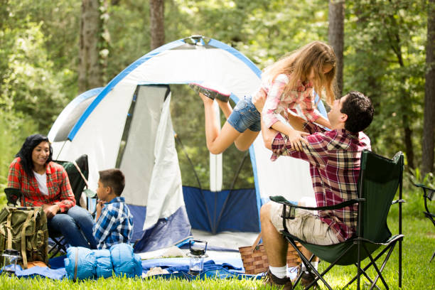 istock Family enjoys summer camping vacation. 653102640
