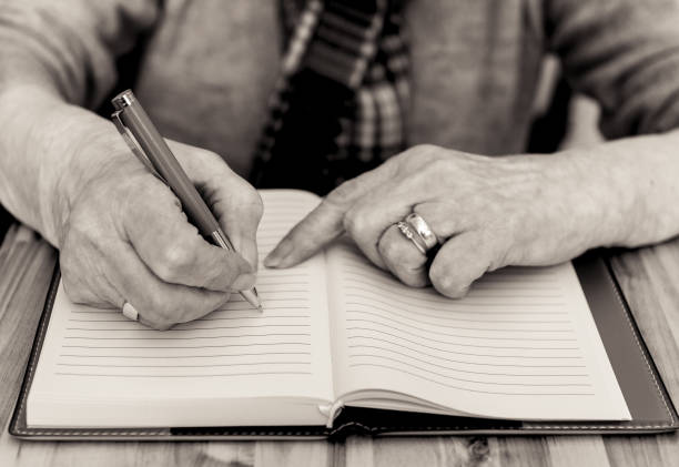 notebook with black pen on the table
