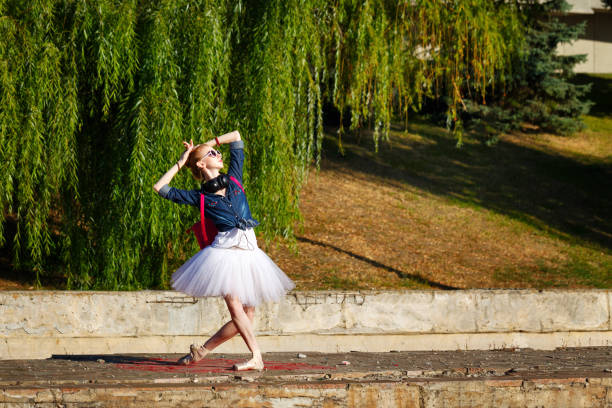 istock Ballerina hipster dancing on the street. 653106842
