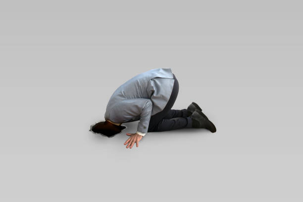istock Business man looking through a ground hole. 653111866