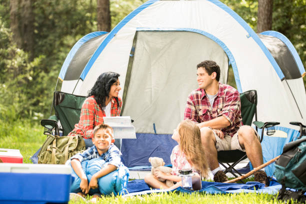 istock Family enjoys summer camping vacation. 653112144
