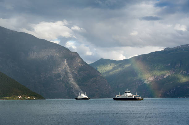 istock Fjord ferries and rainbow landscape 653112384