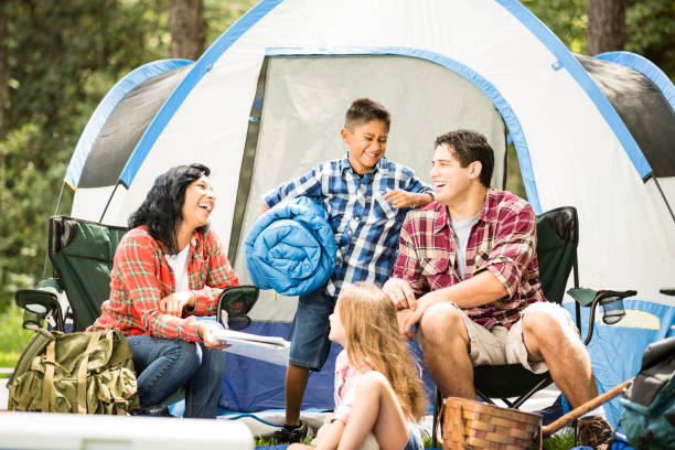 istock Family enjoys summer camping vacation. 653113750