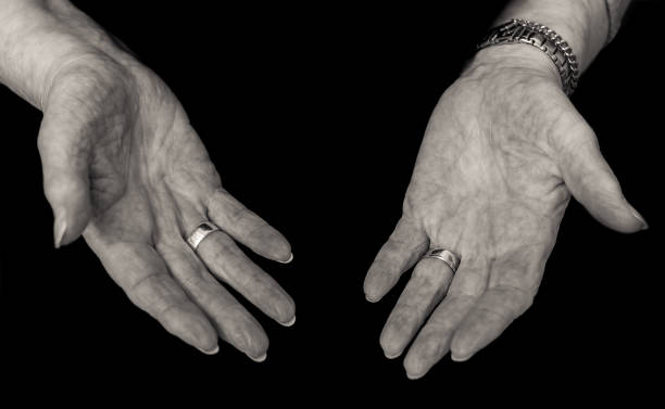 istock Black and white image of older lady's empty hands, 653115928