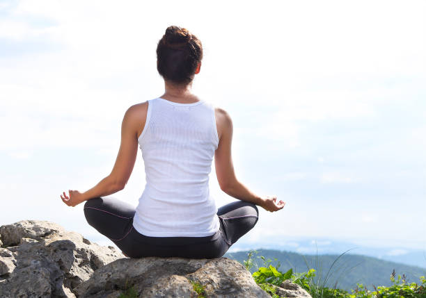 istock Attractive young woman doing a yoga pose 653120058