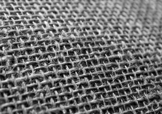 istock Black and white hessian cloth sack texture with blur effect. 653126688