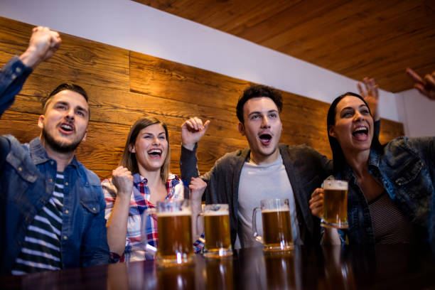 istock Friends enjoying with beer mugs in restaurant 653130326