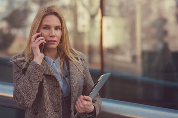 istock Businesswoman talking on smartphone 653132060