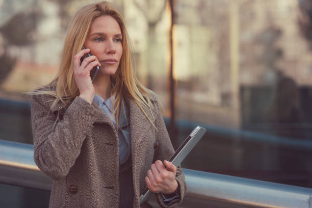 istock Businesswoman talking on smartphone 653132102