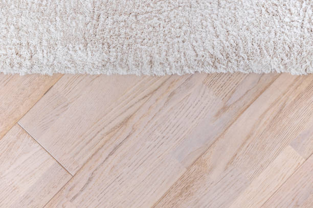 istock Parquete floor with beige soft carpet 653134764