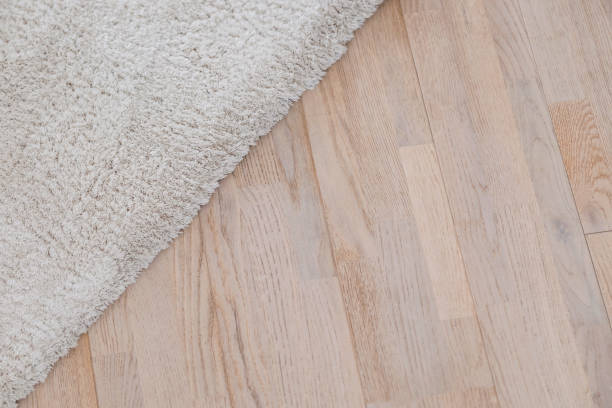 istock Parquete floor with beige soft carpet 653134766