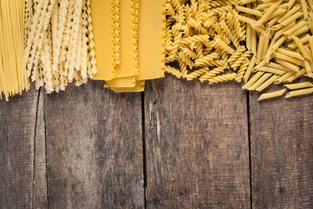 istock Mixed pasta . On a wooden background. 653137784