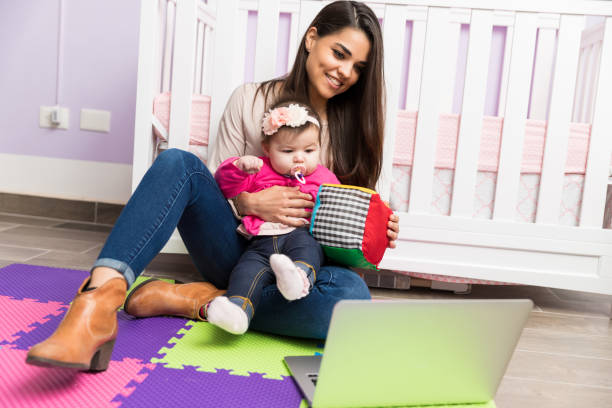 mom and baby doing a video blog - babies and children audio imagens e fotografias de stock