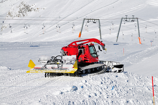 snowplow working on a ski slope in Hintertux Zillertal, Austria