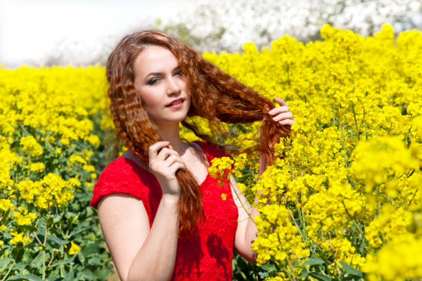istock Young woman on the rape field 653151372