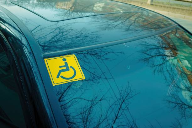 istock Disabled sign on the car glass. 653155612