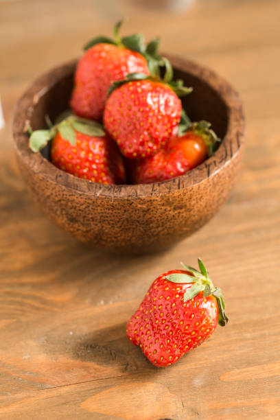istock strawberries in wooden bowl 653156162