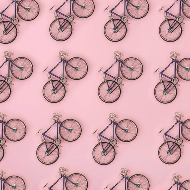 Sport pattern - toy bicycles on pink background