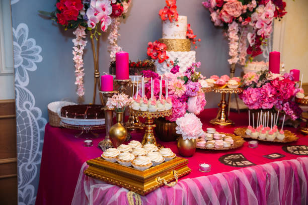 istock Sweet multilevel wedding cake decorated with beautiful flowers. Candy bar 653156214
