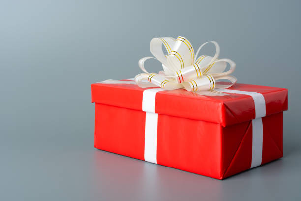 istock Red gift box with white ribbon and bow 653158720