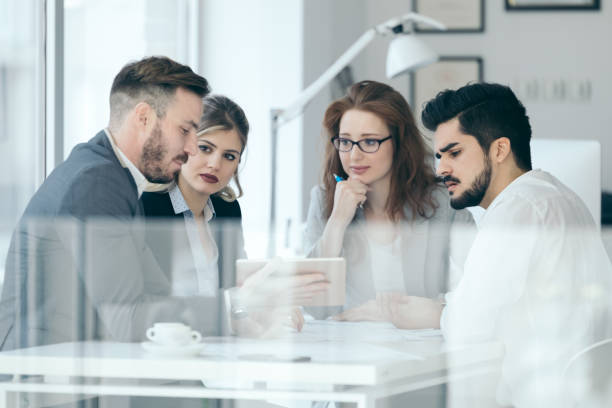 istock Business people and architects collaborating on business project 653160712