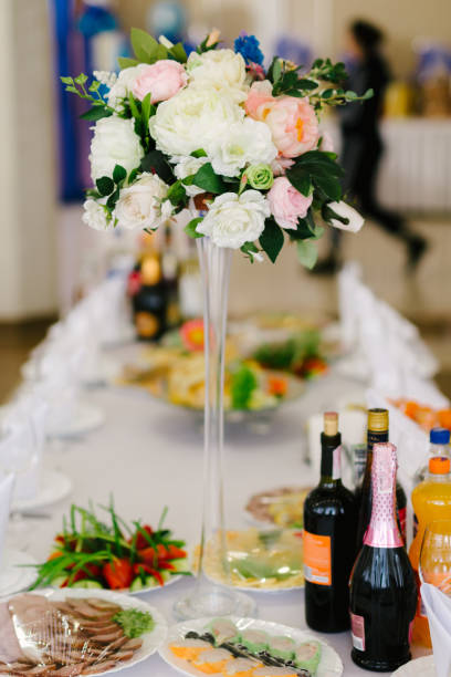 istock Vase with flowers on the wedding table 653160918