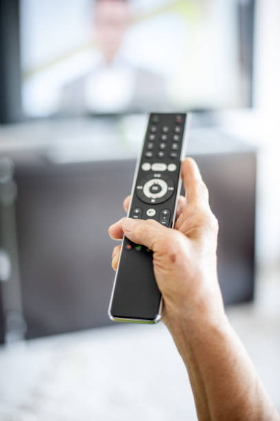 istock Close Up Hands Of Senior Woman Using TV Remote Control 653161284