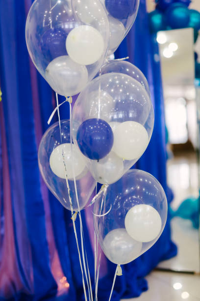 istock Small colorful balloons on a blue background 653163610