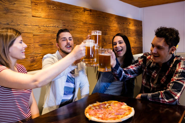 istock Young friends toasting beer 653163634