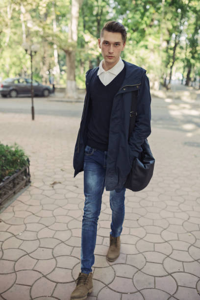 istock Hipster man walking in the streets 653163984