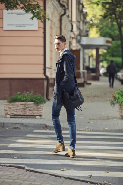 istock Hipster man walking in the streets 653164150