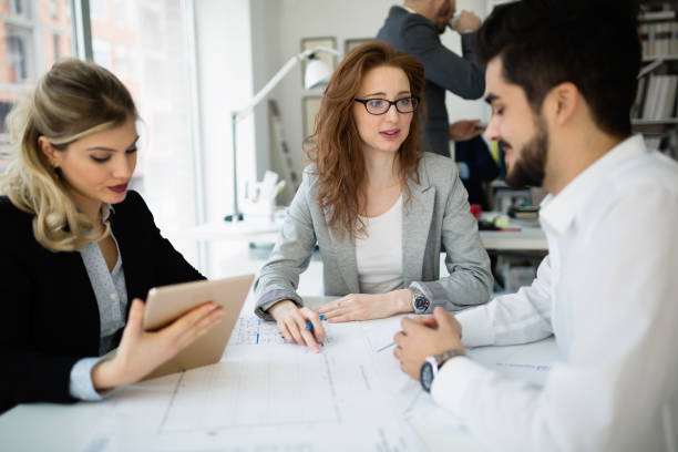 istock Group of architects and business people  working together and brainstorming 653164152